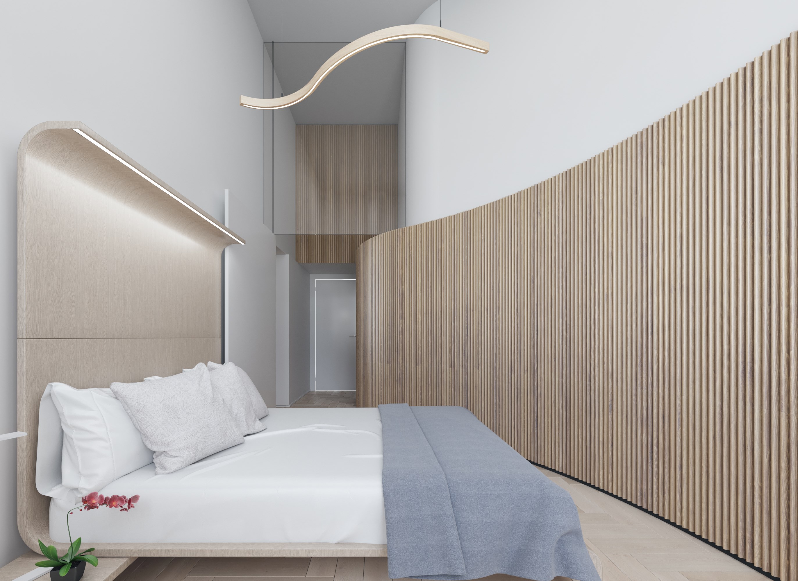 Dormitorio principal con cabecero curvo de madera clara